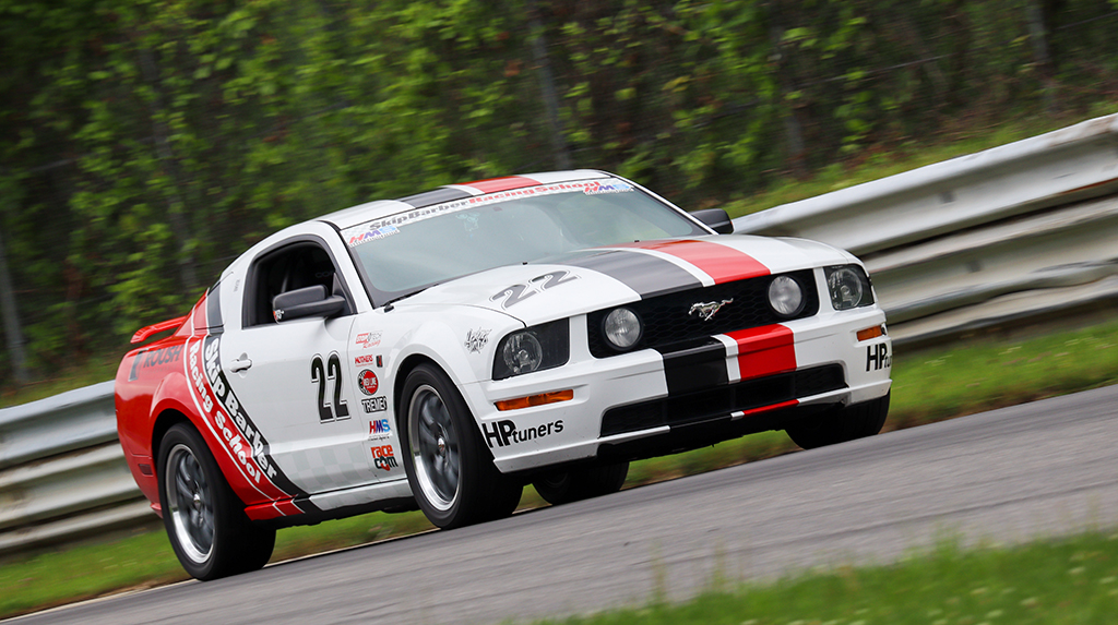 Skip Barber Racing School Mustang GT on a road course.